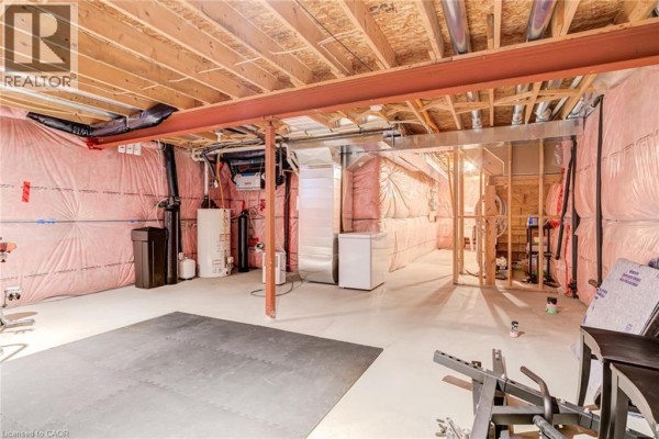 Partially finished basement with exercise equipment - 239 Cranbrook Street Kitchener
