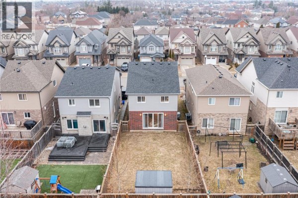 Backyards with decks, sheds, and playsets - 239 Cranbrook Street Kitchener