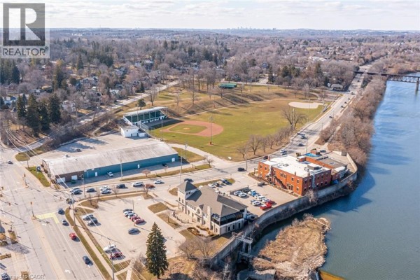 Aerial view of baseball field, industrial building, office buildings, and riverfront - 239 Cranbrook Street Kitchener