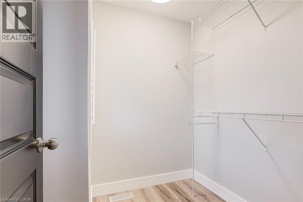 Closet with wire shelving and grey door - 239 Cranbrook Street Kitchener