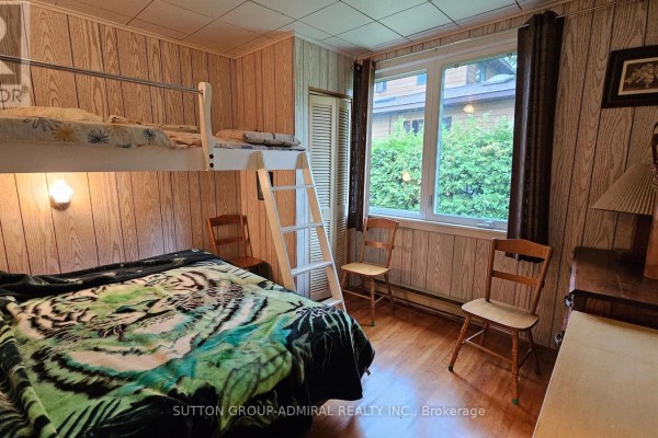 Bedroom with bunk beds and tiger blanket - 2392 Lakeshore Drive Ramara