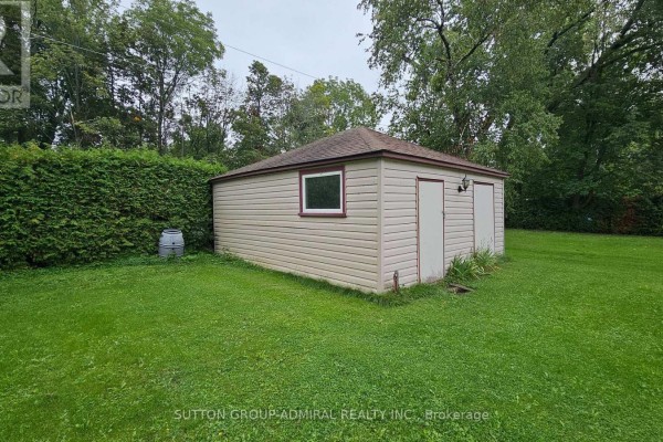 Shed with double doors and window on lawn - 2392 Lakeshore Drive Ramara
