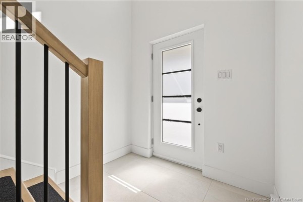 Entryway with a glass door, white walls, and tiled flooring - 24 Adéo-rose, Memramcook