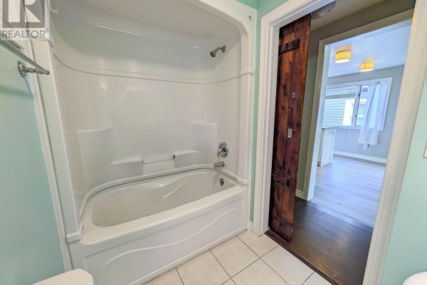 Bathroom with tub and shower, barn door - 24 Churchill Street St Catharines