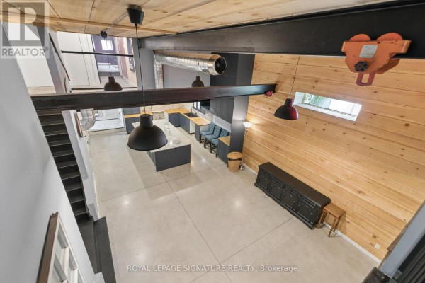 Modern open concept kitchen with island and concrete floors - 24 Davidson Street Cambridge