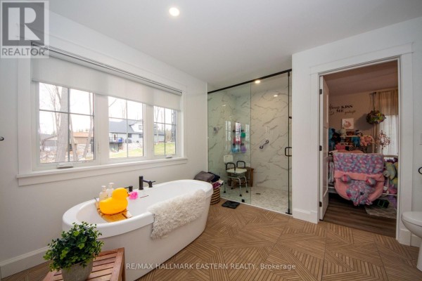 Freestanding tub and glass shower in a modern bathroom - 24 Rory Drive Selwyn