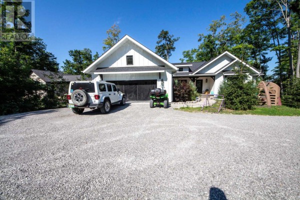Modern farmhouse exterior with white jeep, ATV, and garage - 24 Rory Drive Selwyn