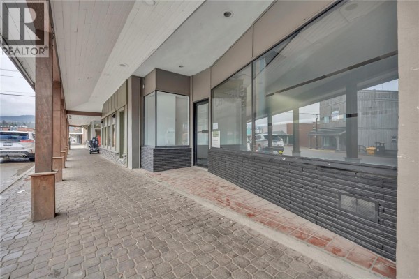 Interior view from the entrance, showcasing tile flooring and a reception area with a view of the street. - 240 Bridge Street, Princeton