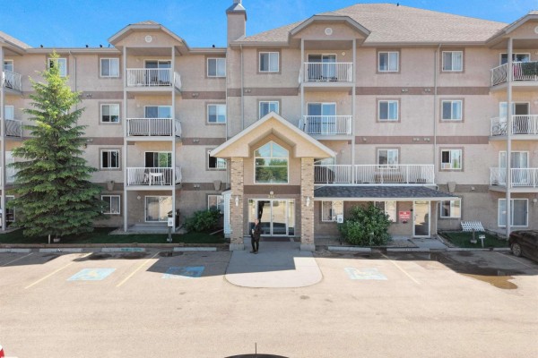 Exterior of apartment building at 240 Spruce Ridge Road, Spruce Grove with paved parking lot. - 240 Spruce Ridge Rd, Spruce Grove