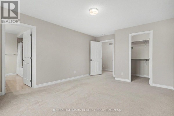 Bedroom with walk-in closet and en-suite access - 240 Sweetvalley Drive Ottawa