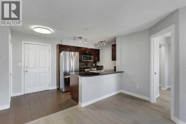 Den - 2402, 403 Mackenzie Way Sw, Airdrie, AB T4B3V7 Photo 4
