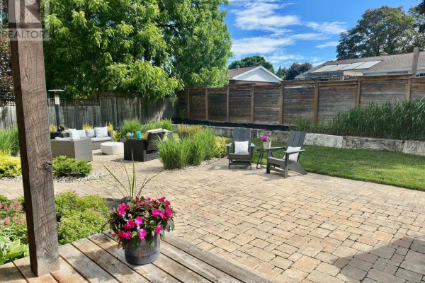 Side view of the house with patio and landscaped yard - 241 4th Street Crescent, Hanover