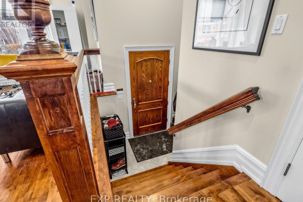 Cozy living area with a fireplace, elegant decor, and natural light from windows. - 241 Poplar Plains Street, Toronto