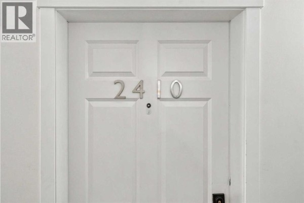 Close-up of a white apartment door with the number 2410. - 2410, 99 Copperstone Park Se, Calgary