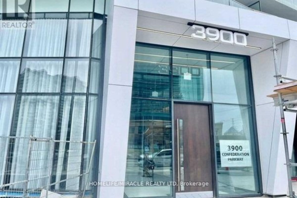 Building entrance at 3900 Confederation Parkway with a modern wood door and glass facade. - 2410 - 3900 Confederation Parkway, Mississauga