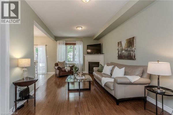 Interior hallway with tiled floor, white doors, and a front door with glass. - 2410 Woodward Avenue Unit# 4, Burlington
