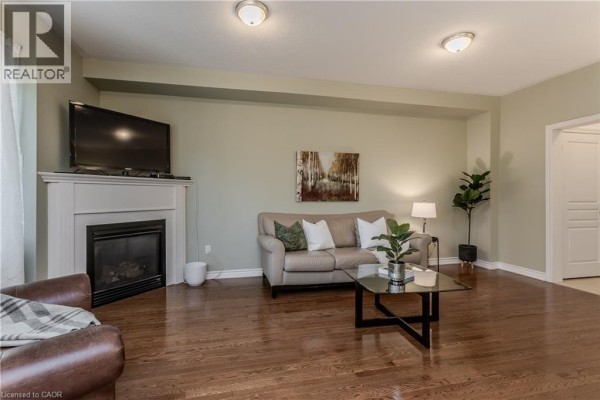 Kitchen with granite countertops, stainless steel appliances, and wooden cabinetry. - 2410 Woodward Avenue Unit# 4, Burlington