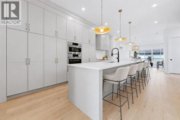 Main floor plan showing open concept living, dining, kitchen, office, and powder room. - 2412 1 Avenue Nw, Calgary