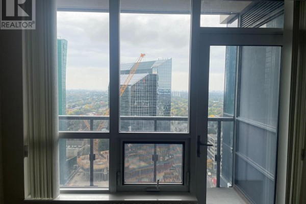 View from apartment window showing city skyline with construction. - 2419 - 5 Sheppard Avenue E, Toronto