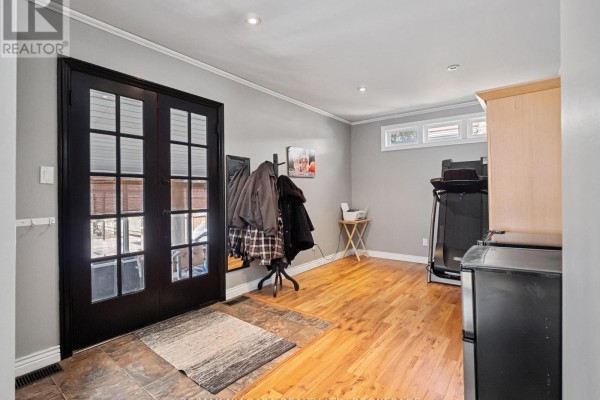 Garage with shelving, tools, and wooden door - 244 North Street Fort Erie