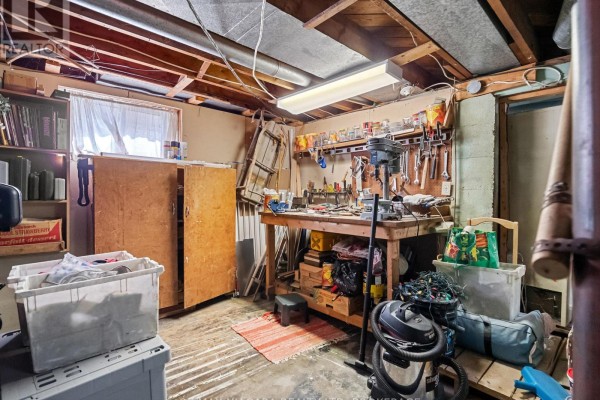 Home office with dual monitors, desk, large window, and lantern - 244 North Street Fort Erie
