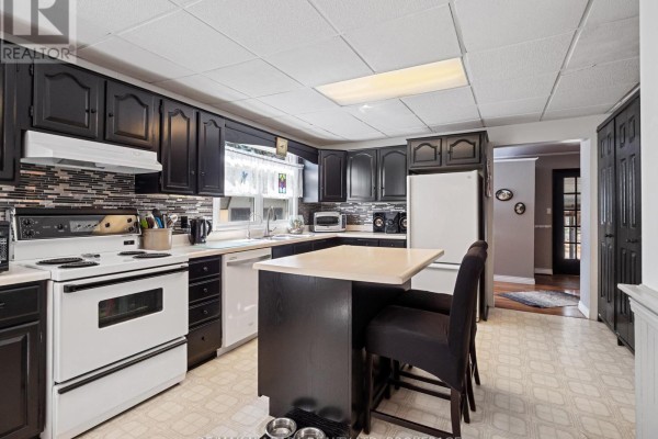 Enclosed patio with sliding doors, furniture, and yard view - 244 North Street Fort Erie