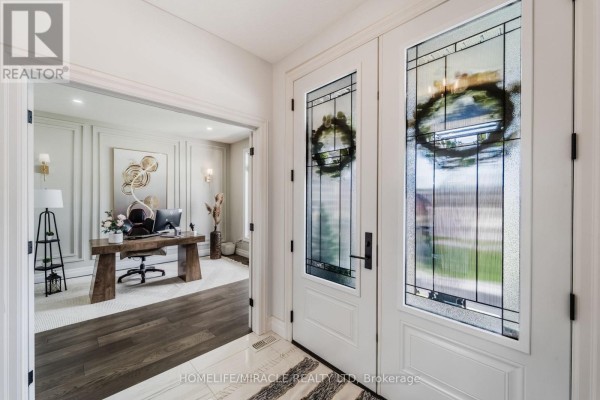 Double front doors with stained glass, leading to office - 245 Tamarack Boulevard Woodstock