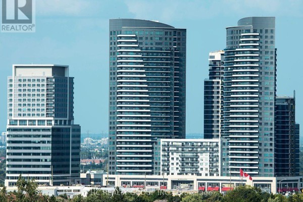 Tall modern apartment buildings with balconies and varying architectural designs under a blue sky. - 247 - 7181 Yonge Street, Markham