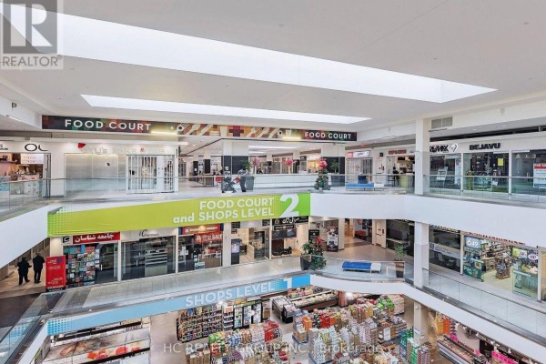 Central information desk with screens and signage in a brightly lit indoor shopping mall. - 247 - 7181 Yonge Street, Markham