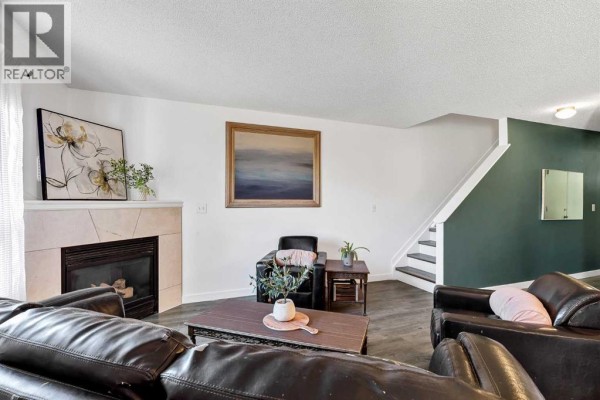 Living room - 25, 156 Canoe Drive Sw, Airdrie, AB T4B2Z3 Photo 4