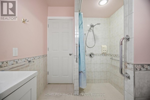 Bathroom with walk-in shower, grab bars, and vanity - 25 Hope Avenue Hamilton