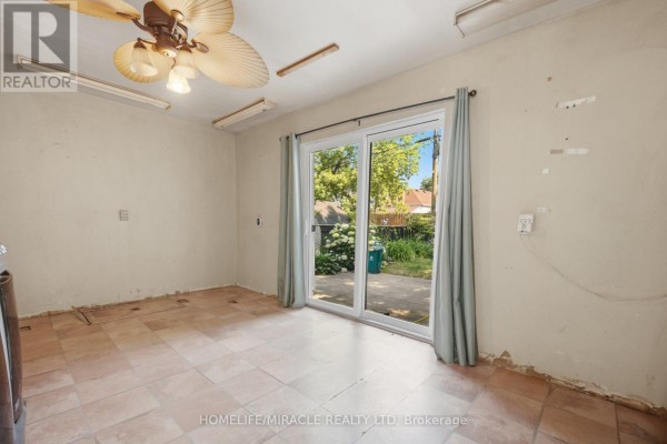 Room with ceiling fan and sliding glass door to backyard - 25 Hope Avenue Hamilton