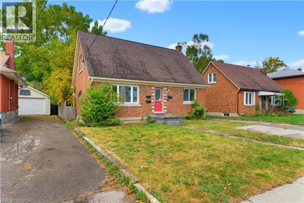 Exterior of a brick house with a garage on the left and driveway. - 25 Meinzinger Avenue, Kitchener