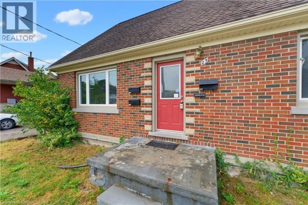 Close-up of the red front door and brick exterior of the house. - 25 Meinzinger Avenue, Kitchener