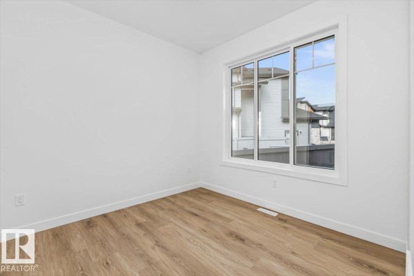 Den - 25 Owl Ridge Cl, Fort Saskatchewan, AB T8L1Y4 Photo 4