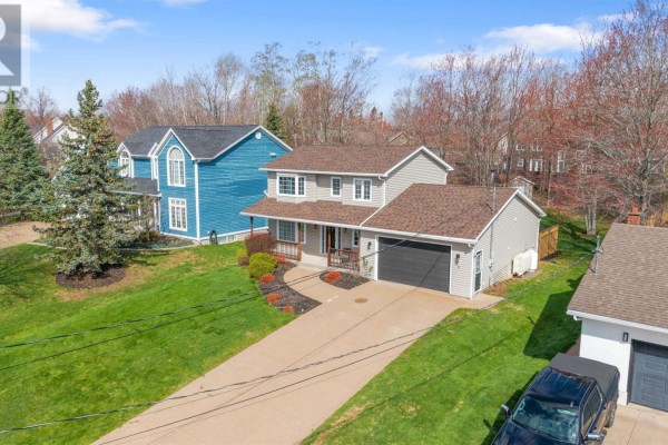 Aerial view of a New Glasgow neighbourhood with houses and a river. - 25 Terrace Heights Drive, New Glasgow