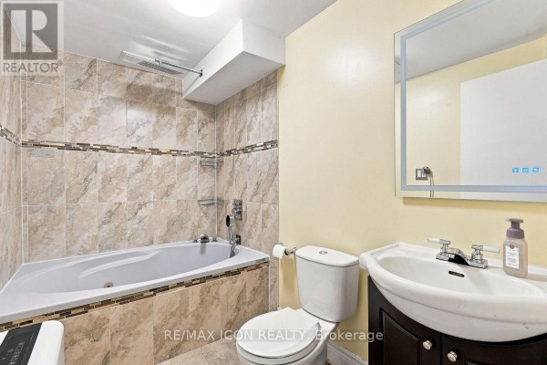 Jetted tub and vanity with illuminated mirror - 25 Upcott Crescent London South