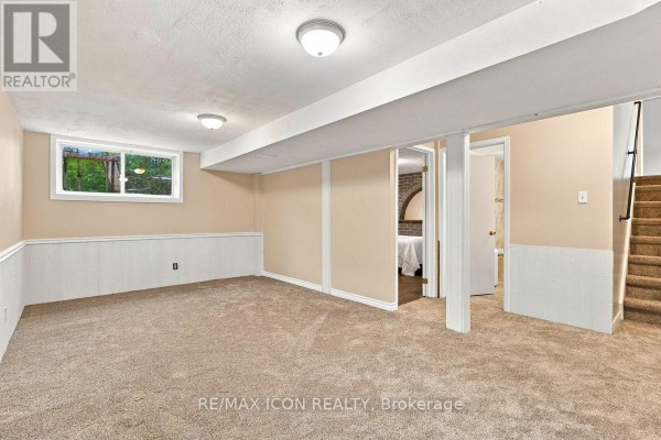 Finished basement with carpet, window, and stairs - 25 Upcott Crescent London South