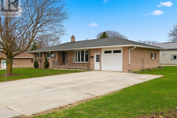 Side view of a brick bungalow showing the driveway and front entrance. - 25 Vincent Street, South Bruce