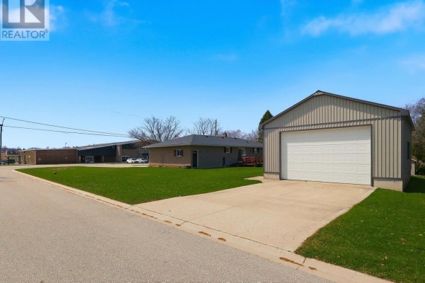 Detached metal garage, brick house, and recreation building - 25 Vincent Street South Bruce