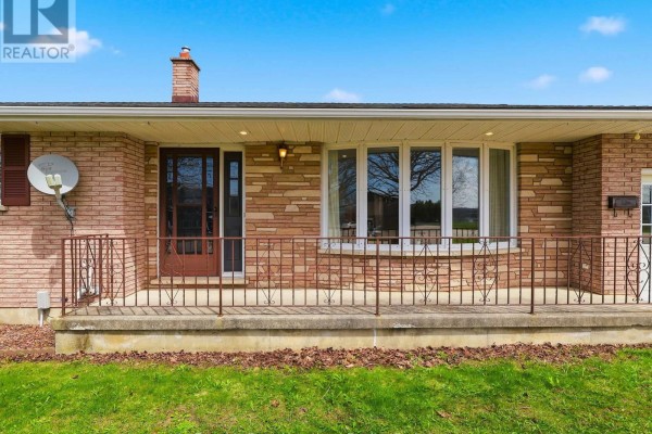 Close-up of the front porch with a bay window and brick and stone facade. - 25 Vincent Street, South Bruce