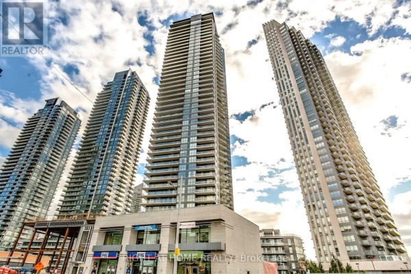 Low-angle view of multiple modern high-rise condo buildings against a cloudy sky. - 2501 - 10 Park Lawn Road, Toronto