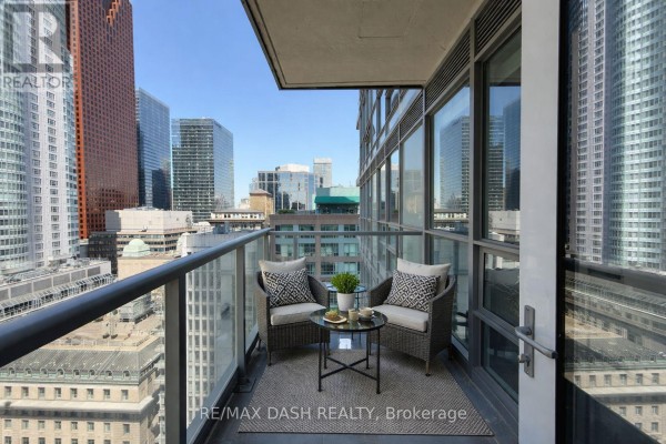 Balcony with seating and panoramic view of downtown Toronto skyscrapers. - 2501 - 88 Scott Street, Toronto