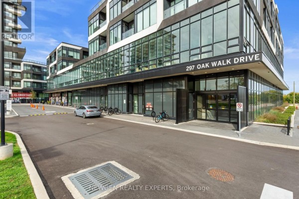 Ground level entrance and storefronts of a modern apartment building with large glass windows and black trim. - 2505 - 297 Oak Walk Drive, Oakville