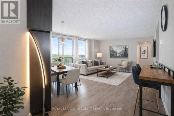 Aerial view of surrounding cityscape with multiple buildings and snow-covered trees. - 2505 - 900 Dynes Road N, Ottawa
