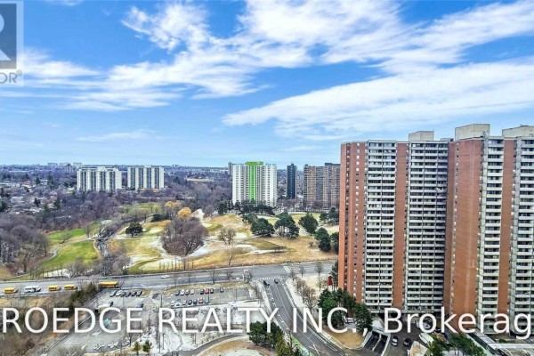 View from above of the apartment complex and surrounding cityscape with a golf course. - 2507 - 5 Massey Square, Toronto