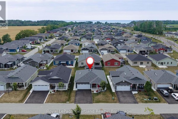 Aerial view of a suburban neighborhood with many similar-looking houses. - 251 Lake Breeze Drive, Ashfield Colborne Wawanosh