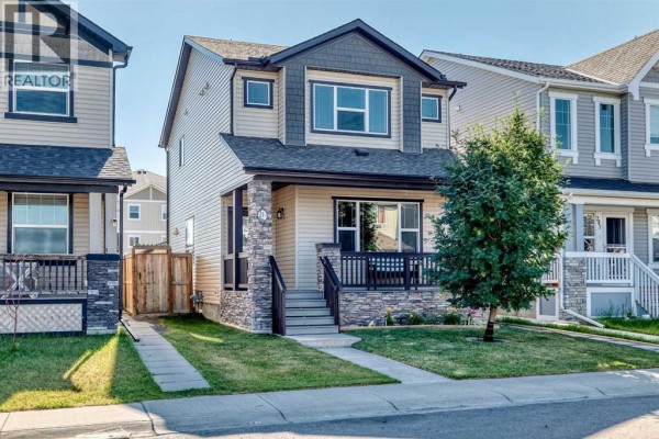 Exterior view of the Calgary home showing the front entrance, driveway, and adjacent properties. - 251 Skyview Point Road Ne, Calgary