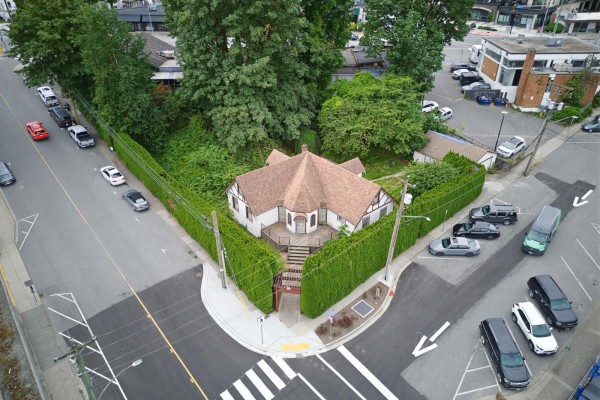 Aerial view looking down at the house and surrounding property with a street corner. - 2517 Montvue Avenue, Abbotsford