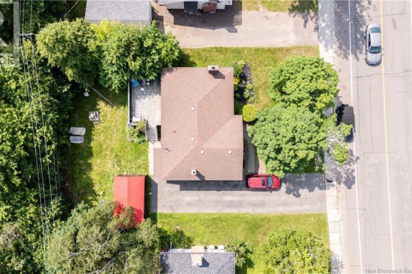 Overhead view of a house with a driveway, deck, and red shed. - 252 Buckingham Avenue, Riverview